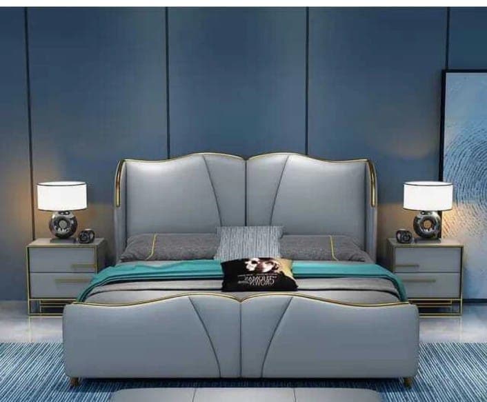 Premium bedroom with deep blue accent wall and grey leather bed with gold trim, Bikaner