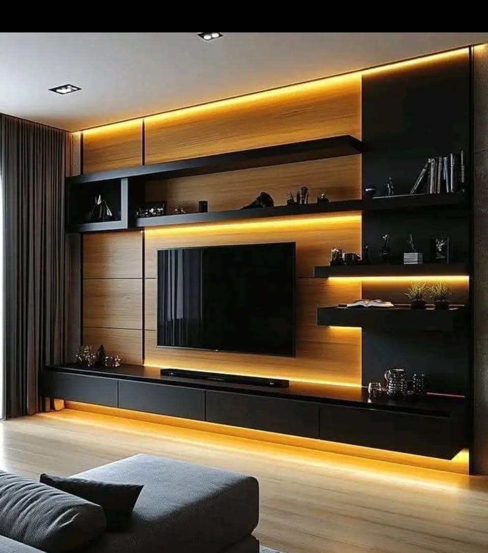 Premium black and wood living room TV unit with warm LED strip lighting by M B Interior